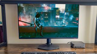 Cyberpunk 2077 being played on an Alienware monitor running from GeForce NOW on a Geekom GT1 Mega mini PC. 