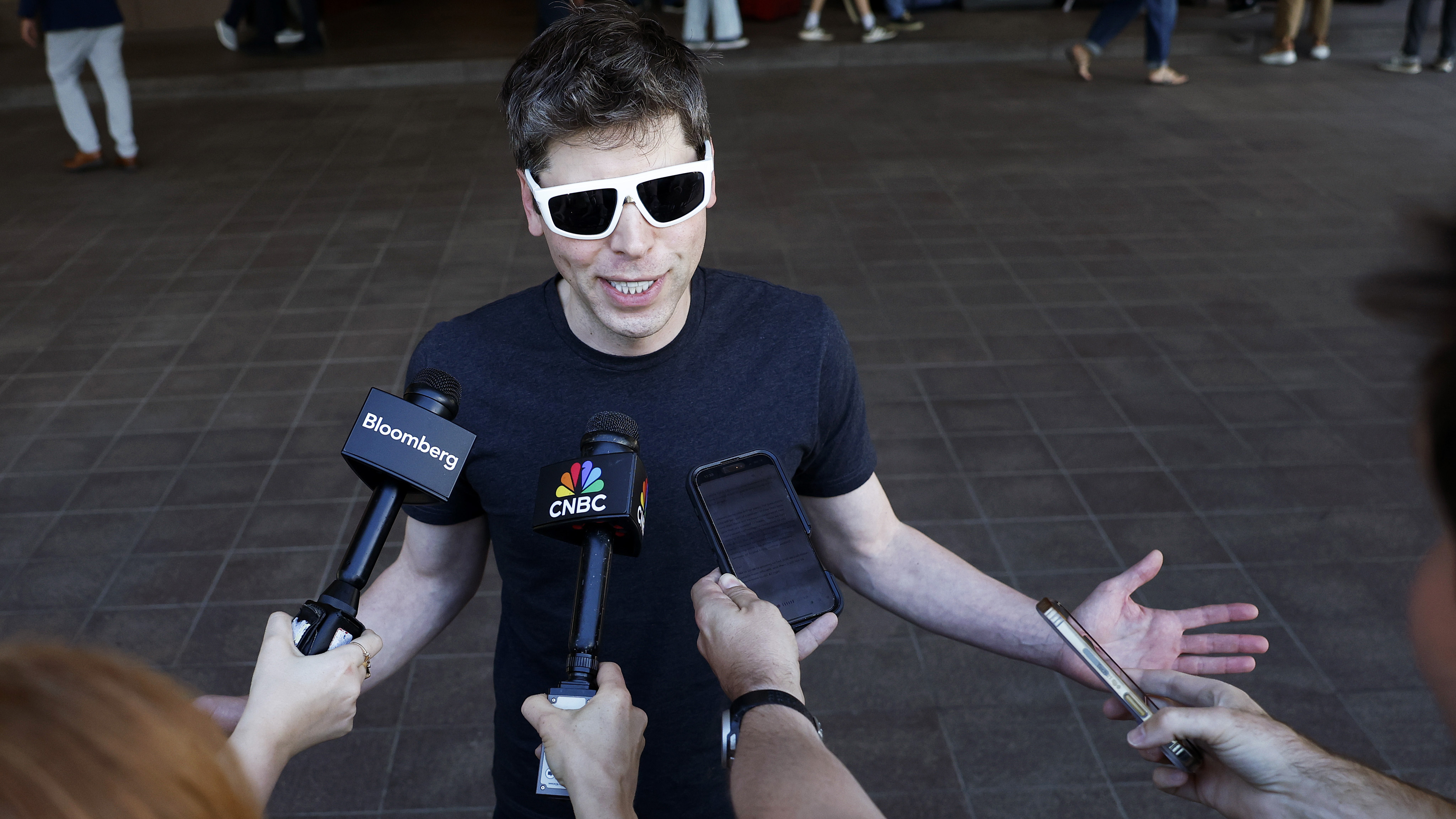 SUN VALLEY, IDAHO - JULY 08: CEO of OpenAI Sam Altman speaks to members of the media as he arrives at the Sun Valley lodge for the Allen &amp; Company Sun Valley Conference on July 8, 2025 in Sun Valley, Idaho. Every year, some of the world's wealthiest and most powerful figures from the media, finance, technology, and political spheres converge at the Sun Valley Resort for the exclusive week-long conference hosted by boutique investment bank Allen &amp; Co.