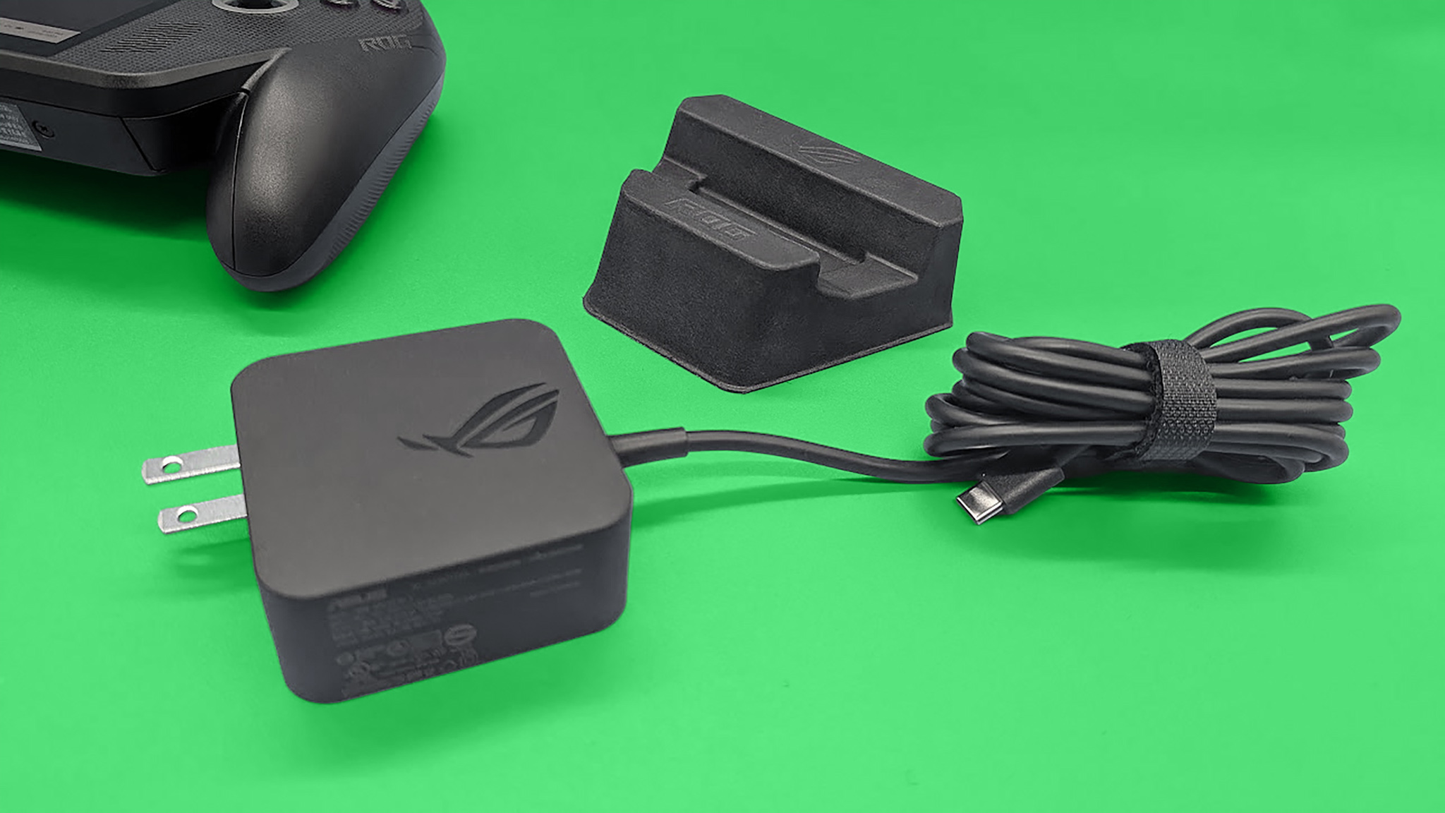 The  ROG Xbox Ally X's charger and included stand.