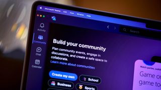 Microsoft Teams app and logo running on a laptop and smartphone.