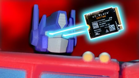 An Optimus Prime figurine shooting lasers out of its eyes at a WD_BLACK SSD. 