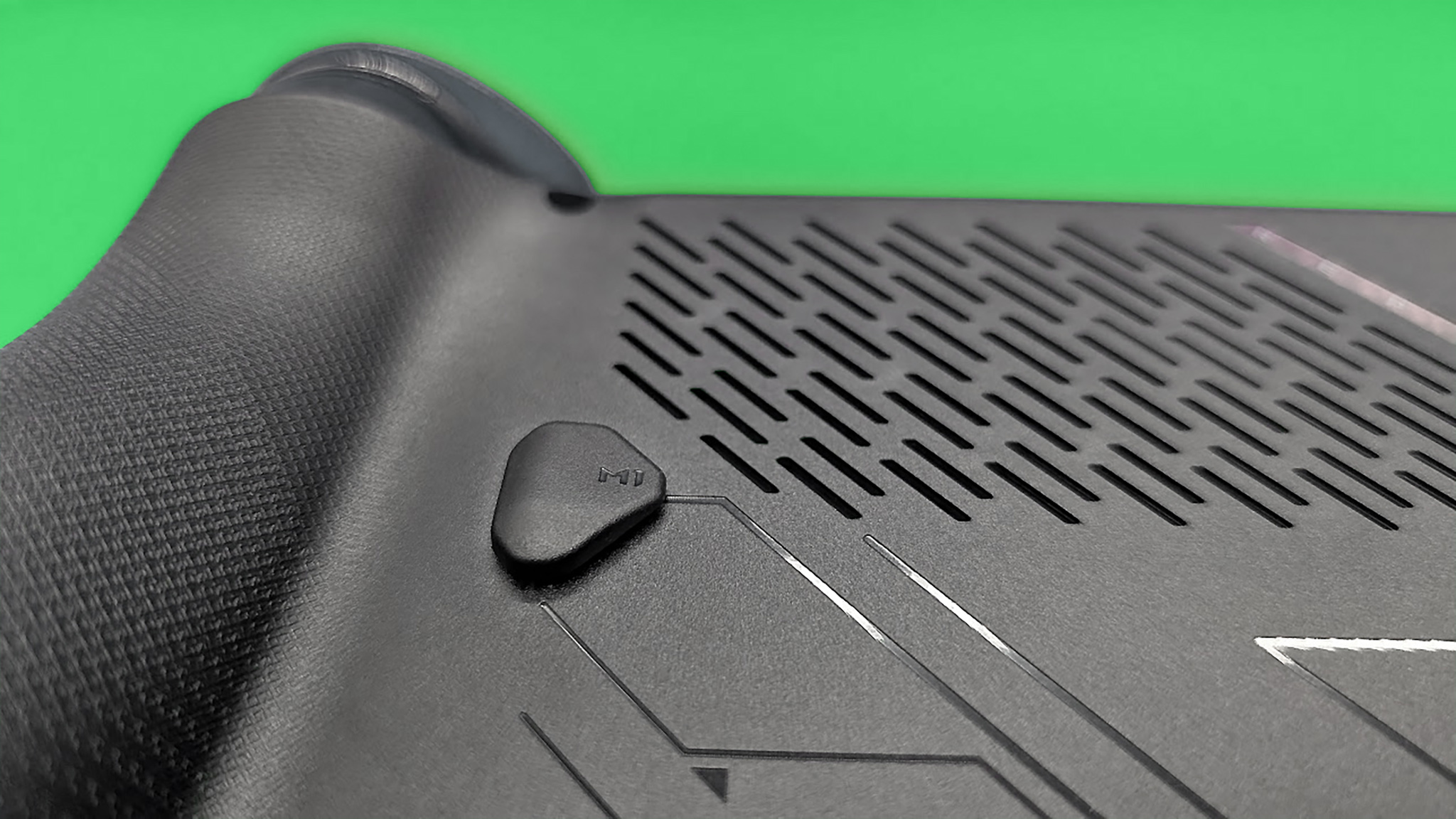A closeup of the M1 button on the back of the ROG Xbox Ally X .
